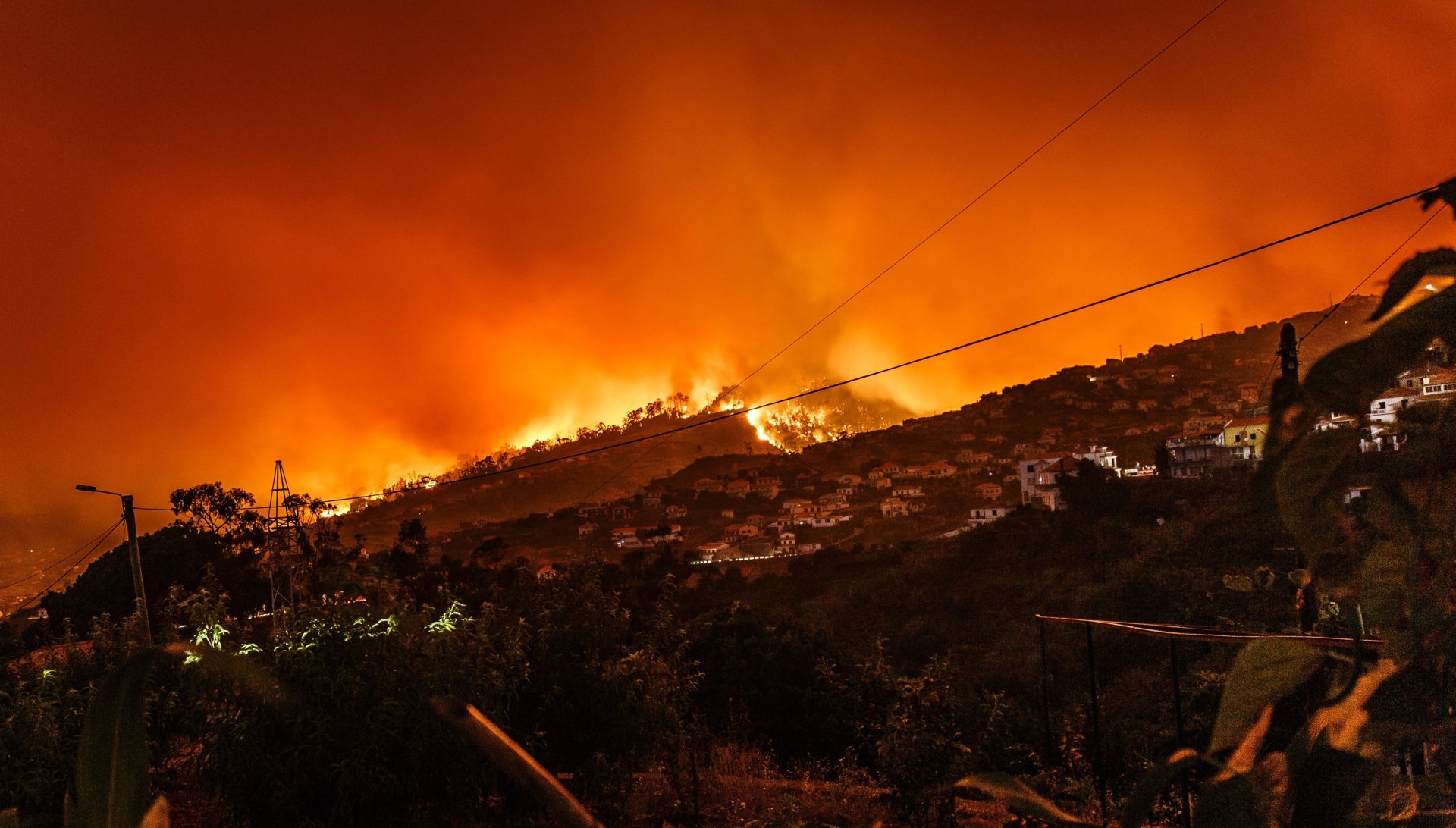Wildfire near a community, illustrating the setting for incident and re-entry support